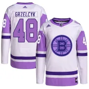 Adidas Men's Matt Grzelcyk Boston Bruins Authentic Hockey Fights Cancer Primegreen Jersey - White/Purple